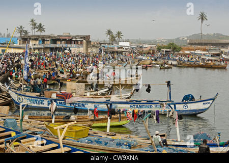 Fish market and fishing boats in harbor, Elmina, Ghana Stock Photo