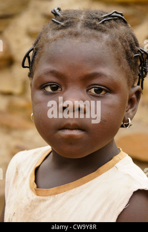 Little girl with tribal scarring on cheek, northern Ghana Stock Photo