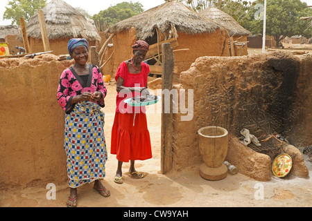 Women in house compound, Mognori Eco-Village, Ghana Stock Photo