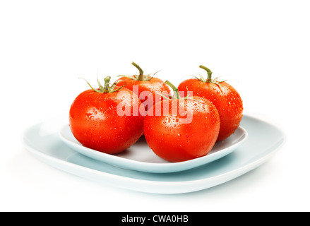 Fresh tomatoes on bowls over white Stock Photo