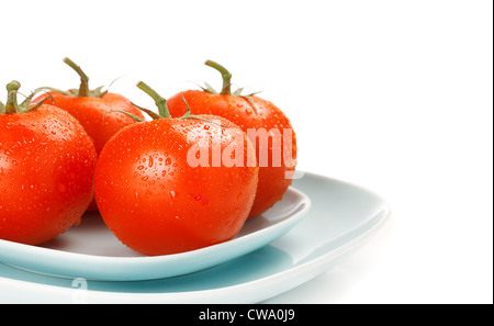 Fresh tomatoes on bowls over white Stock Photo