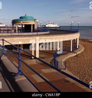 Eastbourne Bandstand, promenade and railings with pier beyond, Eastbourne, East Sussex, England, UK Stock Photo