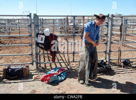 Young cowboy preparing himself for the bull riding contest of the Mount Isa Rodeo in Outback Queensland Stock Photo