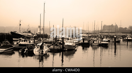 Misty morning over Scarborough harbour in South Byl, Scarborough, North Yorkshire, UK Stock Photo