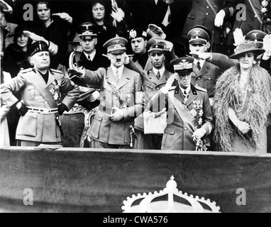 ROME, ITALY: Premier Benito Mussolini (left) views a parade of Italian might with (left to right) his guest Adolf Hitler, King Stock Photo