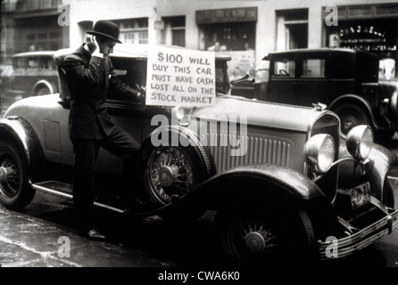 Man trying to sell his expensive car for $100 after being wiped out in the Stock Market Crash, 1929.. Courtesy: CSU Archives / Stock Photo