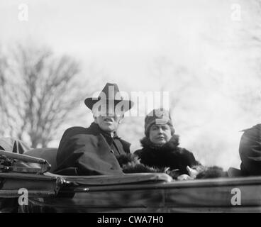 Woodrow Wilson (1856-1924) and his second wife, Edith Bolling Galt Wilson riding in an open carriage in Washington, DC. Stock Photo