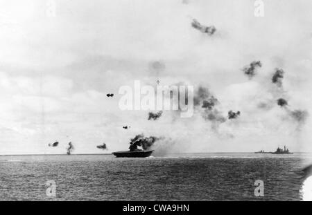 BATTLE OF MIDWAY The USS Yorktown is hit portside by a torpedo from a ...