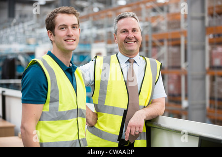 Two men in warehouse, portrait Stock Photo