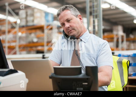 Warehouse manager on the phone Stock Photo