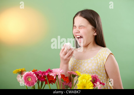 Girl with flowers sneezing