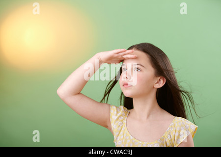 Girl shielding eyes Stock Photo