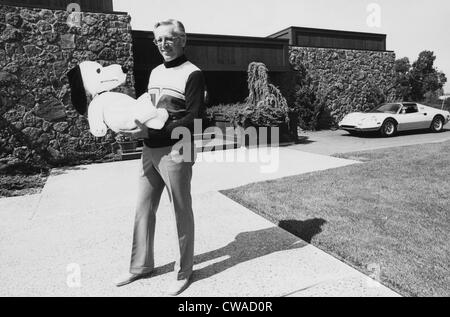 Charles M. Schulz, (1922-2000), American cartoonist and creator of the comic strip 'Peanuts', holding a Snoopy doll, Santa Stock Photo