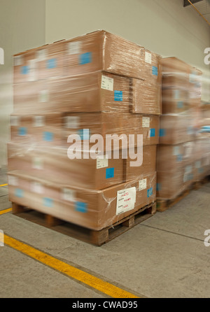 Stack of cardboard boxes and stack of pallets, isolated on white Stock ...