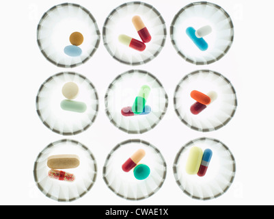 Pills in dispenser cups Stock Photo