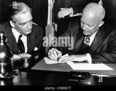 British Prime Minister Anthony Eden watches as President Dwight D. Eisenhower signs a joint statement on the 3 day talks Stock Photo