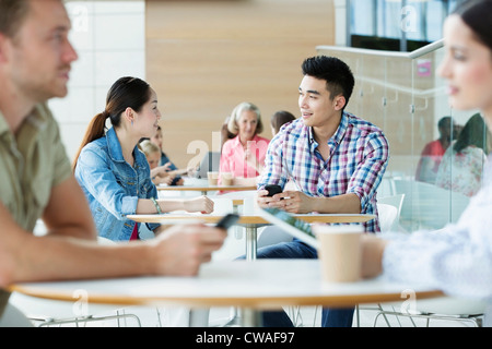 Young couple in canteen area Stock Photo