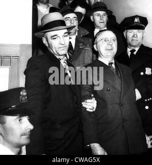 Foreground, center: George Metesky, (aka 'The Mad Bomber'), at his booking at Waterbury police station, Connecticut, January Stock Photo