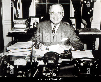 PRESIDENT HARRY TRUMAN working in his White House office, 1946.. Courtesy: CSU Archives / Everett Collection Stock Photo