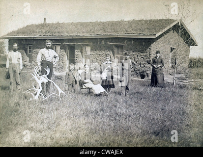 Morrison family in front of sod house in Custer County, Nebraska in 1886. Lumber was scare and sod dwellings were the first Stock Photo