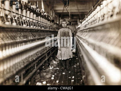 Child laborer portrayed by Lewis Hine in 1909.  Little spinner who regularly worked in cotton mill in Augusta, Georgia. Stock Photo