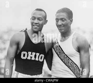Jesse Owens (1913-1980) with Ralph Metcalfe (1910-1938) teammates and rivals at the 1936 Berlin Olympics.  Between them, they Stock Photo