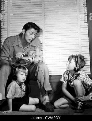 Robert Mitchum (top left), and his sons, Chris Mitchum (left), and Jim