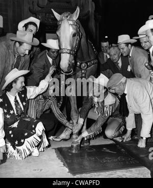 Western film star Roy Rogers (second from right), being honored at Grauman's Chinese Theater along with his horse Trigger, as Stock Photo