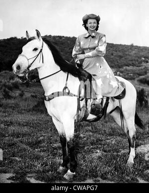 Dale Evans (1912-2001), American actress, singer and wife of Roy Rogers, with her horse Buttermilk, circa 1956. Courtesy: CSU Stock Photo