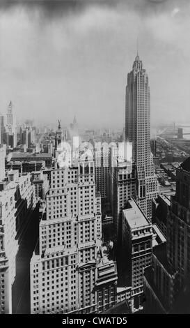 The slender 950 foot tower of 70 Pine Street (right mid-ground) was the last of the Jazz Age skyscrapers in Manhattan's Stock Photo