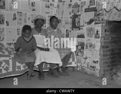 African American mother with her two daughters living in primitive conditions as plantation tenants in Gees Bend, Alabama. Stock Photo