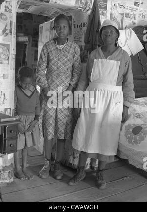 African American mother with her two daughters living in primitive conditions as plantation tenants in Gees Bend, Alabama. Stock Photo