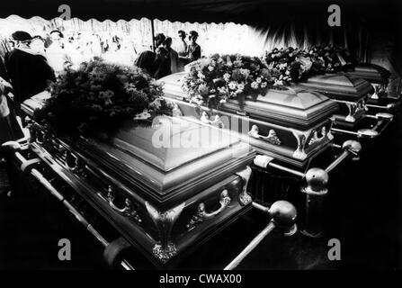 High school classmates of Nancy and Kenyon Clutter, look on their caskets and their parents who were slain in their farm home, Stock Photo