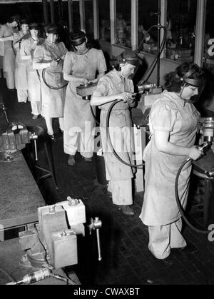 Women did 'men's' jobs during World War II. Here are women working at grinders in the split gear deparment of a factory, Stock Photo