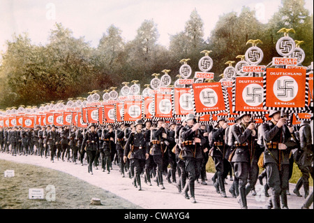 Nazi Germany, Nazi SS troops marching with victory standards at the Party Day rally in Nuremberg, 1933. Stock Photo