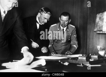 British Prime Minister Neville Chamberlain signing the Munich Treaty with Nazi Germany, 1938 Stock Photo