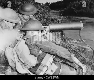 World War II, a machine gun crew of American troops in the British West Indies, gaurding a strategic point along a river during Stock Photo