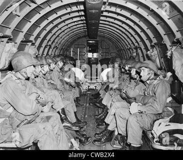 World War II, U.S. paratroopers awaiting orders to jump during maneuvers over England, circa 1942. Stock Photo