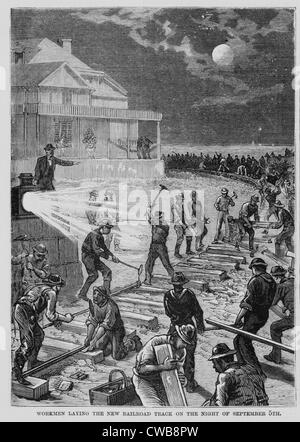 Workmen laying the new railroad track on the night of September 5th. New Jersey, 1881 Stock Photo