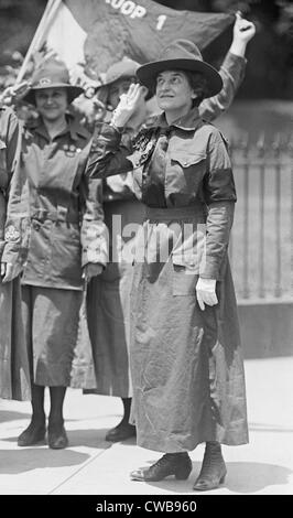 Juliette Gordon Low, founder of the Girl Scouts of the USA, salutes while wearing a Girl Scout uniform. 1917 Stock Photo