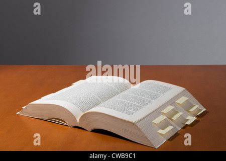 a book with many yellow reminders Stock Photo