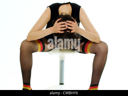 Berlin woman wears pantyhose with the Germany flag motif Stock Photo