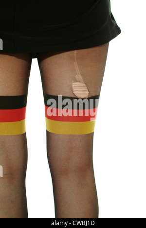 Berlin woman wears pantyhose with the Germany flag motif Stock Photo