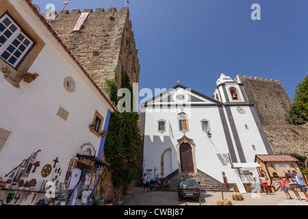 Santiago Church and Albarrã Castle Tower. Óbidos, Portugal Stock Photo