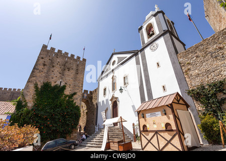 Santiago Church and Albarrã Castle Tower. Óbidos, Portugal Stock Photo