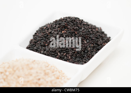 black and white sesame seed in white bowl Stock Photo