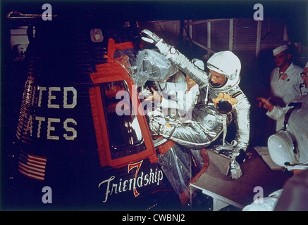 Overall view of astronaut John Glenn, Jr., (Lt. Colonel, USMC) as he enters into the spacecraft Friendship 7 prior to the first Stock Photo