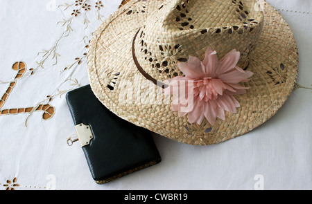 A locked diary pictured with a Lady's straw hat Stock Photo