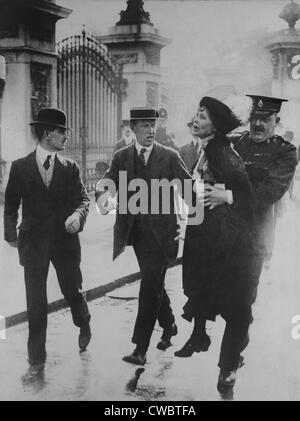 British suffragette Emmeline Pankhurst arrested and carried away by a policeman for leading suffragettes attempt to present a