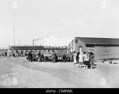 Japanese Americans amid the tar paper barracks of the Tule Lake Relocation Center in Newell, California. This bleak camp was Stock Photo